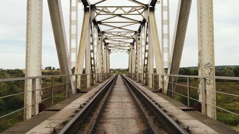 Train movement. Flying over the iron bridge from the railroad tracks Stock Footage 140988346
