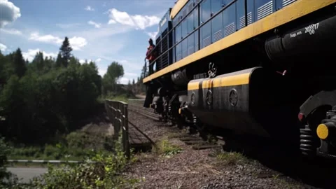 The train moves across the bridge on which the railway is laid. Stock Footage 150108599