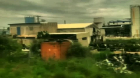 The train moves past the old abandoned destroyed factory in industrial zone Stock-Footage 150237027