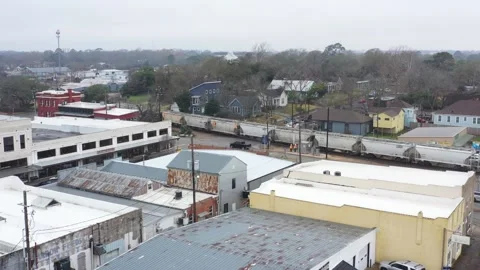 Train Moves Through a Small Old Downtown, Brenham, Texas, USA Stock Footage 147237526