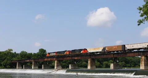 Train moving across bridge over Grand River in Caledonia,Canada, exclusive 4K Video stock 170616493