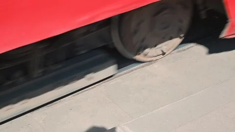A train is moving along metal tracks, showing its wheels in action and the rail Stock Footage 339090739