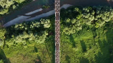 Train moving on bridge above a river Stock Footage 112737636