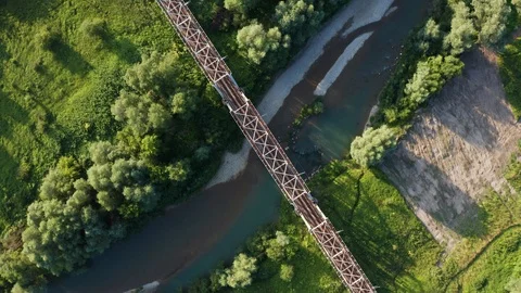 Train moving on bridge above a river Stock Footage 112737696