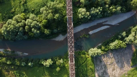 Train moving on bridge above a river Stock Footage 112737906