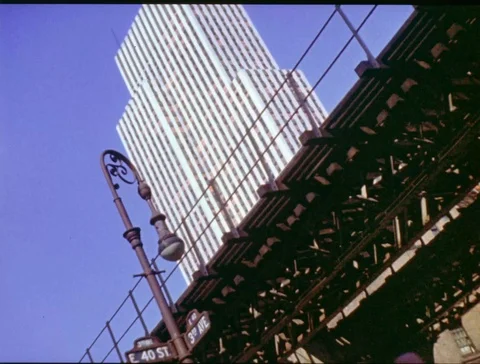 Train moving on bridge in front of New York city buildings Stock Footage 111706649