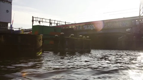 Train moving on bridge over canal in Amsterdam Stock Footage 71535618