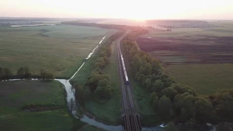 Train moving in direction of sunrise. Stock Footage 242527485