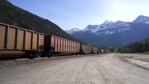 Train moving fast along the tracks in the mountains. Stock Footage 203819327