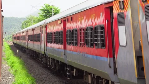 Train moving in  forest wide view in Konkan railway Stock Footage 248489477