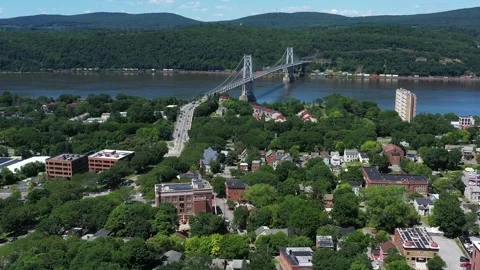A Train Moving up the Hudson River Drone Aerial View Poughkeepsie New York USA Stock Footage 335665601