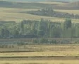 Train moving out of sight in countryside SD Footage