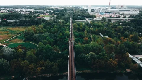 Train Moving on Railway Bridge Over the River in Poznan, Naramowice District. Video stock 248872056
