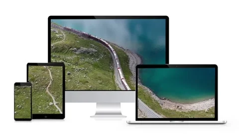 A train is moving on the screens of a smartphone, tablet, laptop and monobloc 스톡 동영상 200844363