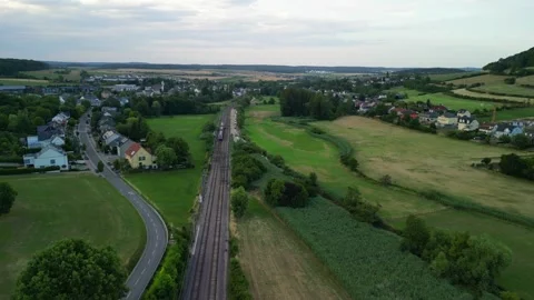 Train moving through the countryside Stock Footage 245706884