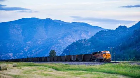 Train moving through flathead reservation in montana mountains 스톡 사진
