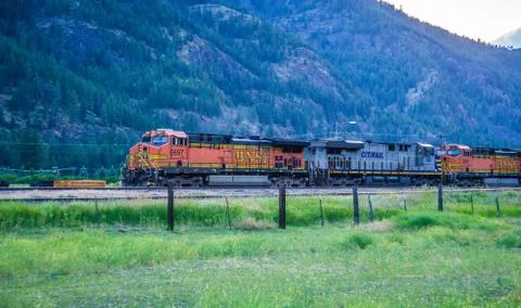 Train moving through flathead reservation in montana mountains 스톡 사진