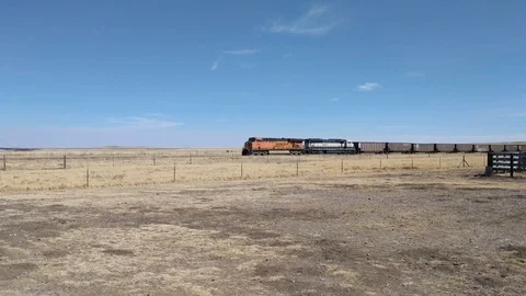 Train moving through West Texas Desert Stock Footage 88755035