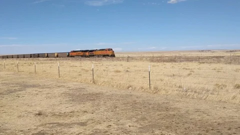 Train moving through West Texas Desert Stock Footage 88755098