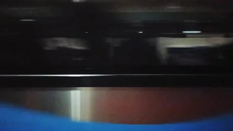 A train that is moving very fast, seen from the passenger window of the train Stock Footage 312863092