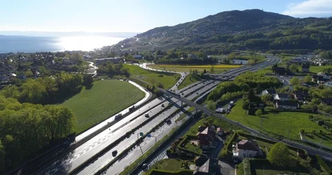 Train MVR crossing highway, direction St-Légier - Aerial 4K Stock Footage 107042844