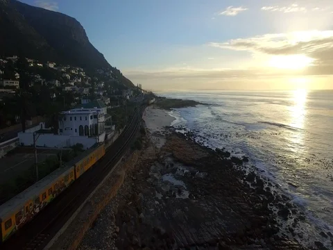 Train Next to Beach in Kalk Bay, Cape Town Aerial View Stock Footage 79756668