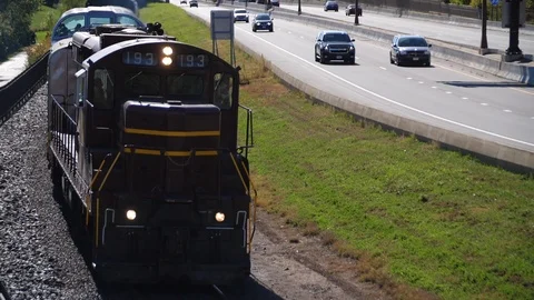 Train next to freeway Slow Motion HD 24p Stock Footage