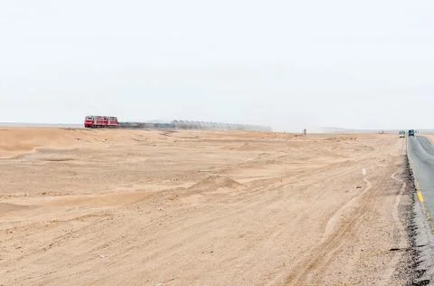 Train next to road C14 between Swakopmund and Walvis bay Stock Photos