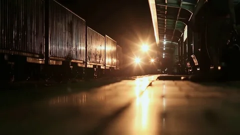 The train at night arrives at the platform of the railway station. Vietnam. Stock Footage 79715746