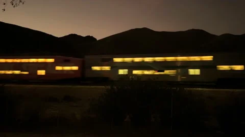 Train At Night Through Desert Mountains Video stock 225591348