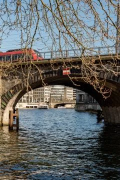 A train on an old bridge at the river Spree Stock Photos