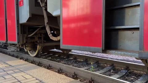 The train opens the doors and passengers get out on the platform Stock Footage 158551912