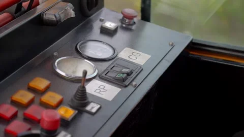 Train Operator Hand Using Control Panel With Gauges and Switches Inside Cab Stock Footage 337976462