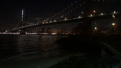 Train Over Brooklyn Bridge at Night Stock Footage 100944458