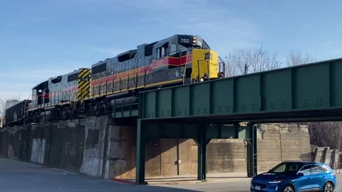 Train On Overpass - City - Bright Sun - Iowa Interstate Stock Footage 167287598