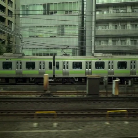 Train overtaking another train in Japan Stock Footage 69409197