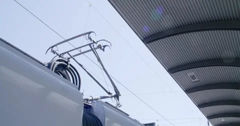 Train Pantograph Touching Overhead Catenary Line, Blue Sky Above, Close Up Shot Stock Footage 340663803