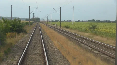 Train pass fast moving landscape line track tourism travel summer day pov grass Stock Footage 39218855