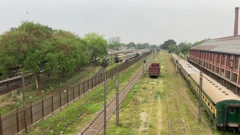 Train of passenger is moving in Lahore on April 14, 2024 Stock Footage 273101313