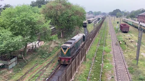 Train of passenger is moving in Lahore on April 14, 2024 Stock Footage 273102387