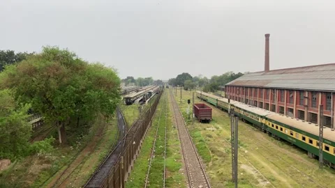 Train of passenger is moving in Lahore on April 14, 2024 Stock-Footage 273103089