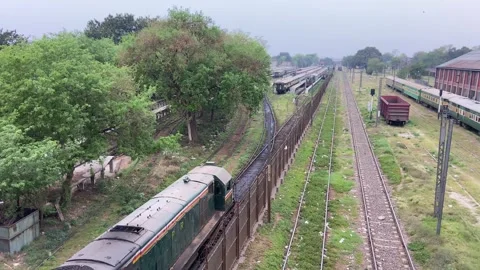 Train of passenger is moving in Lahore on April 14, 2024 Stock Footage 273103296