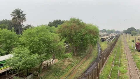 Train of passenger is moving in Lahore on April 14, 2024 Stock Footage 273103752