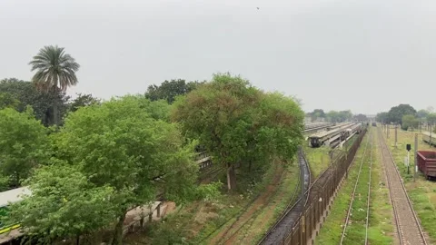 Train of passenger is moving in Lahore on April 14, 2024 스톡 동영상 273104032