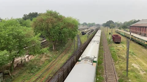 Train of passenger is moving in Lahore on April 14, 2024 Stock Footage 273104897