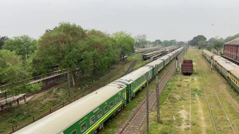 Train of passenger is moving in Lahore on April 14, 2024 스톡 동영상 273105261