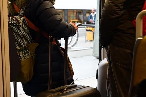 Train passenger using a mobile phone. Foto stock