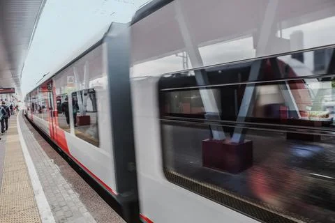 Train with passengers moving by rail Stock Photos
