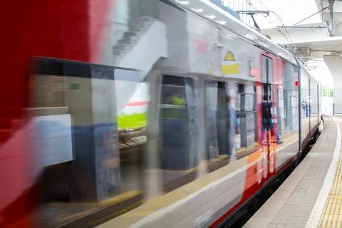 Train with passengers moving by rail Stock Photos
