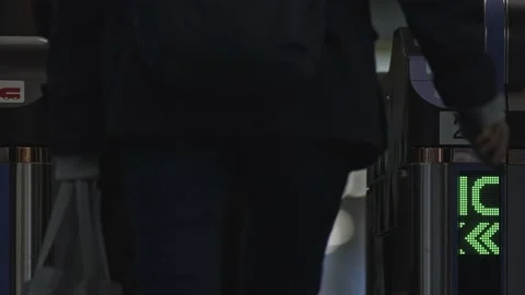 Train passengers passing through an electronic ticket station. Stock Footage 169027449
